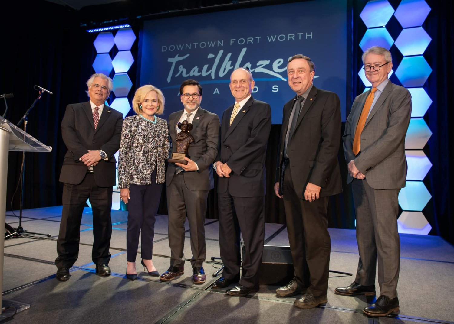 Dean Robert B. Ahdieh (third from left) poses with award alongside DFWI representatives 
