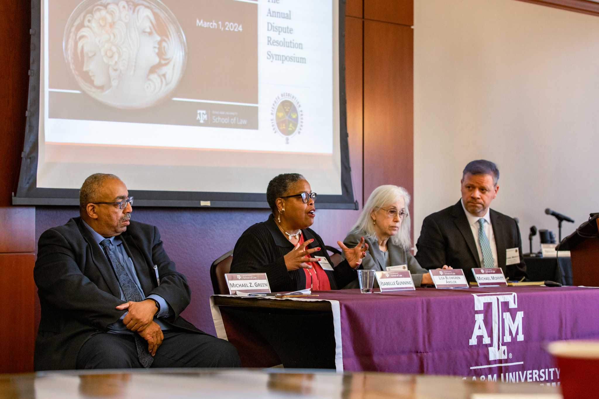 A speaker panel talks to attendees at the annual ADR Symposium in March.