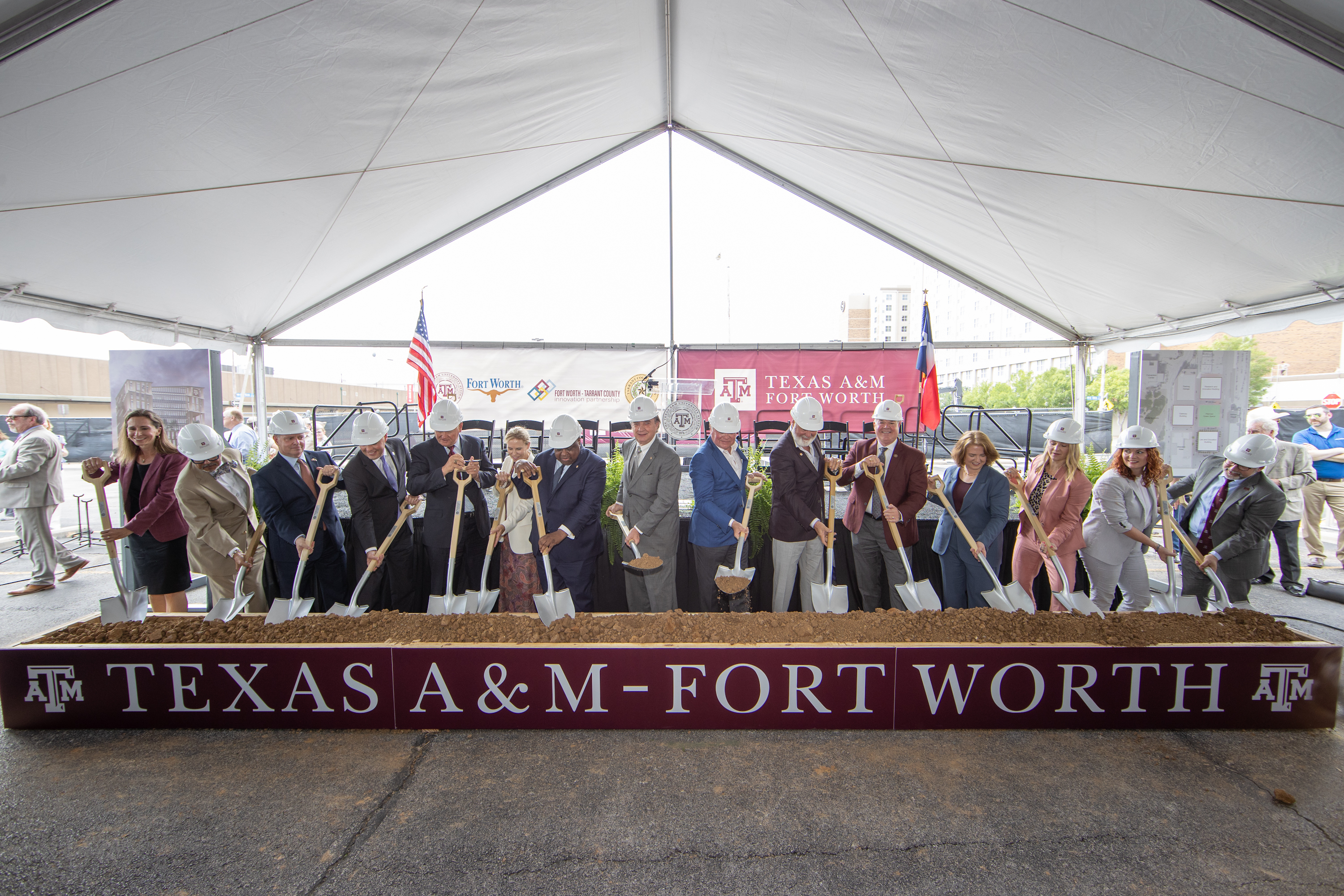 Texas A&M System Leadership wield shovels at the Texasd A&M-Fort Worth groundbreaking ceremony